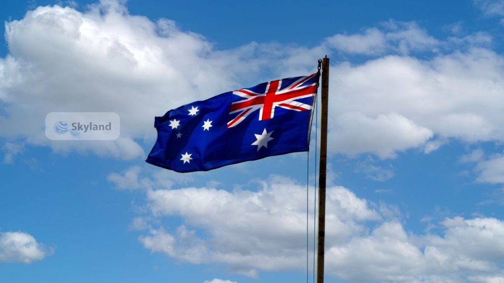 Australian flag flying against a blue sky