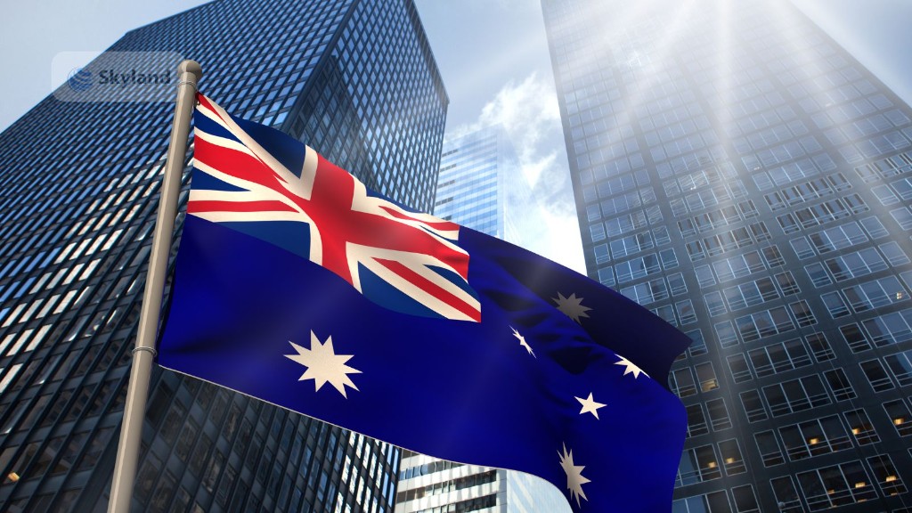 Australian flag against city skyscrapers