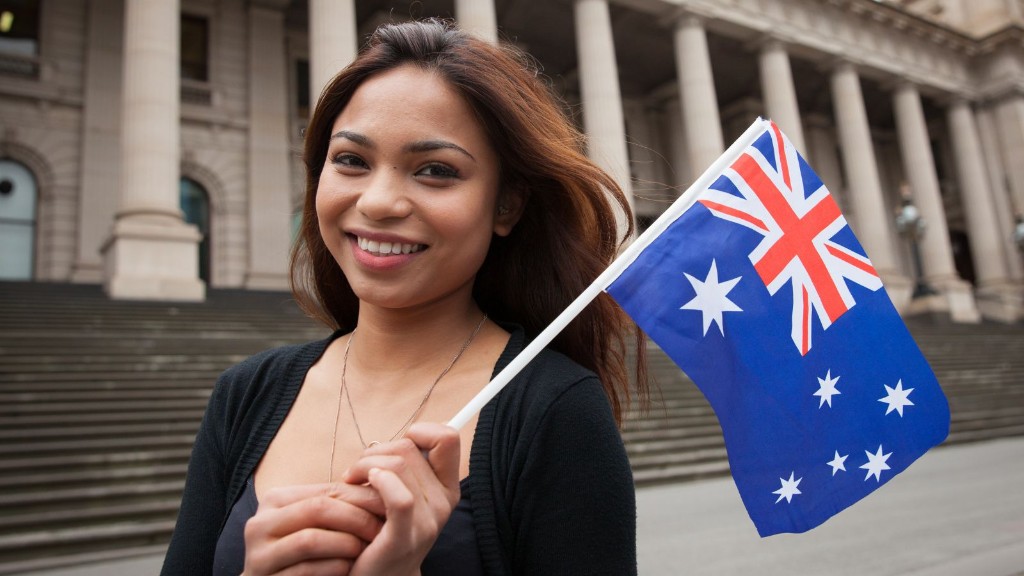 Smiling woman holding the Australian flag
