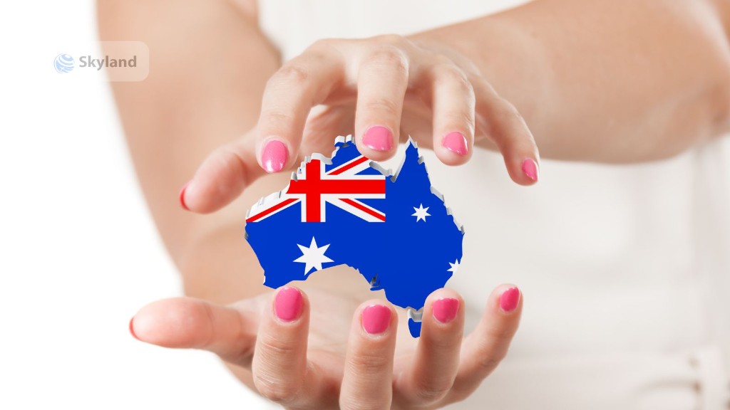 Hands holding a map of Australia with the Australian flag