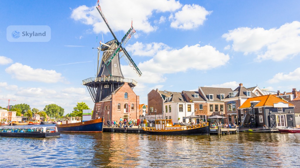 Traditional Dutch windmill beside a canal