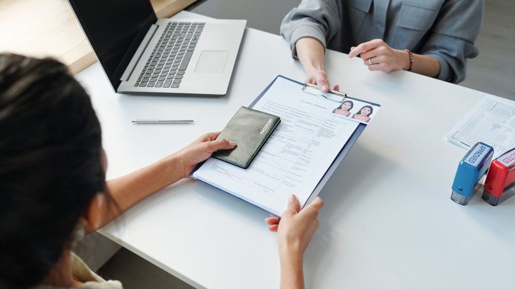 Submitting a visa application with passport and approval stamp