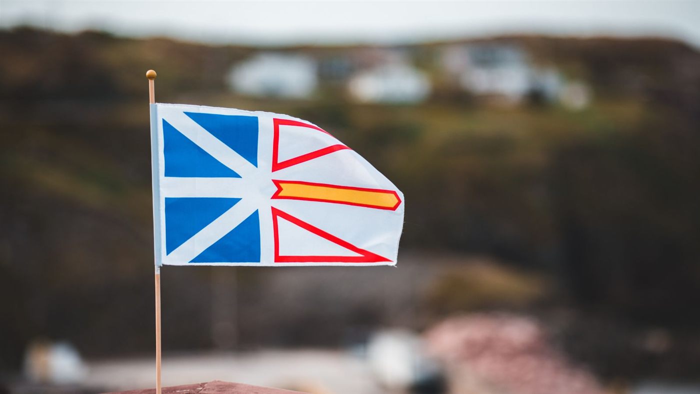 Newfoundland and Labrador flag on a map of Newfoundland