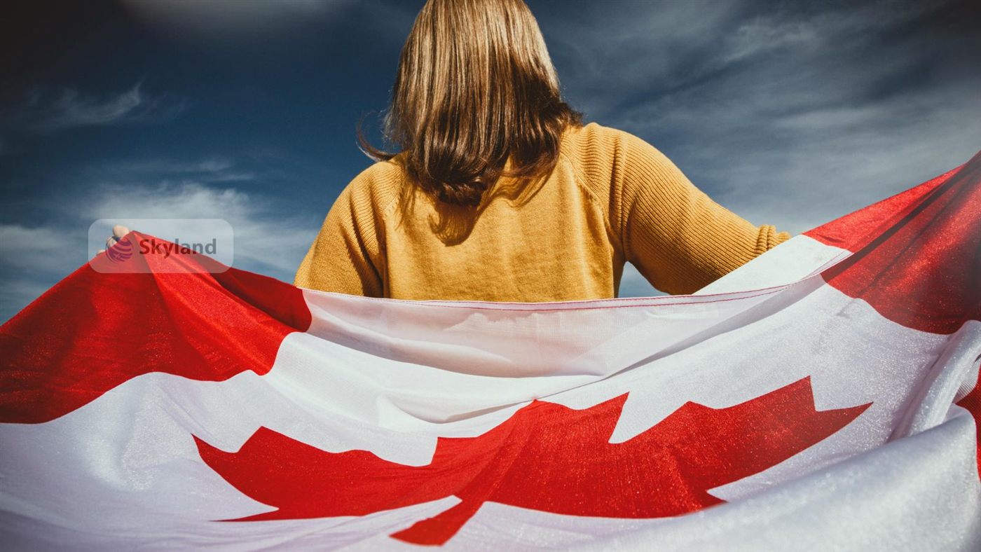 Woman holding a Canadian flag