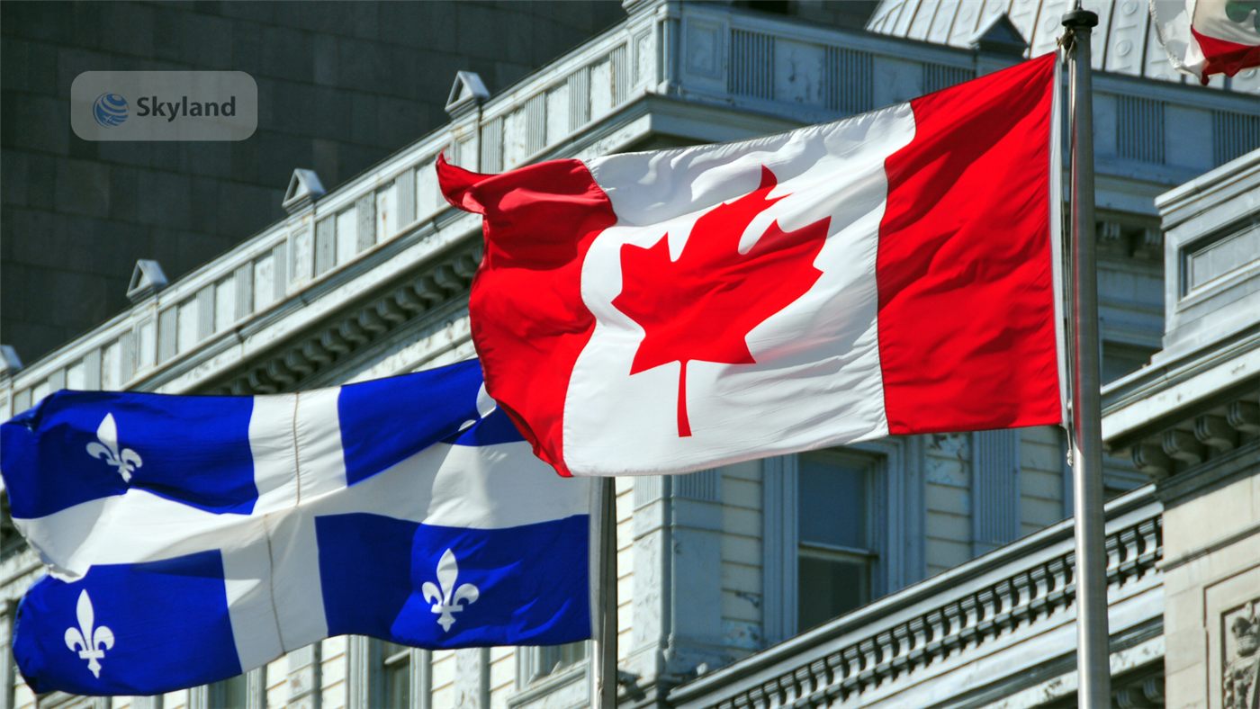 Canadian and Quebec flags in front of a government building