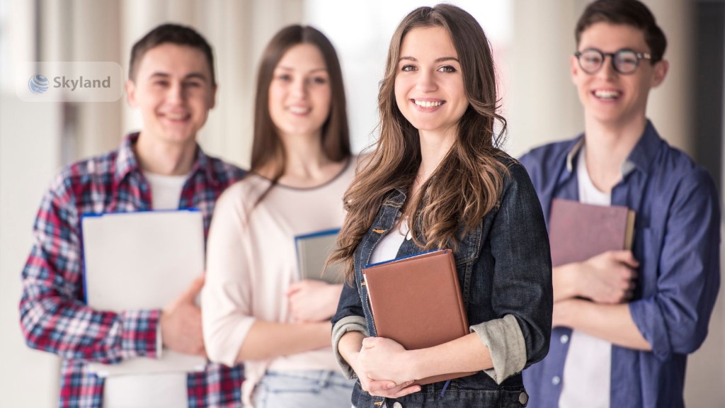 Students holding books on a university campus