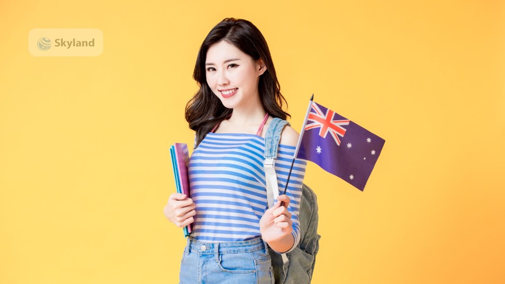 Student holding colourful folders and an Australian flag