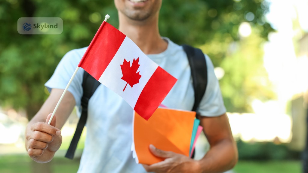 Student holding a Canadian flag and colourful folders