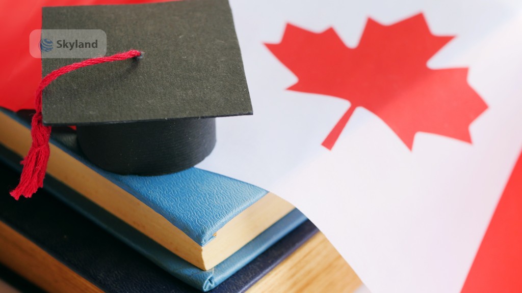 Graduation cap and books with the Canadian flag