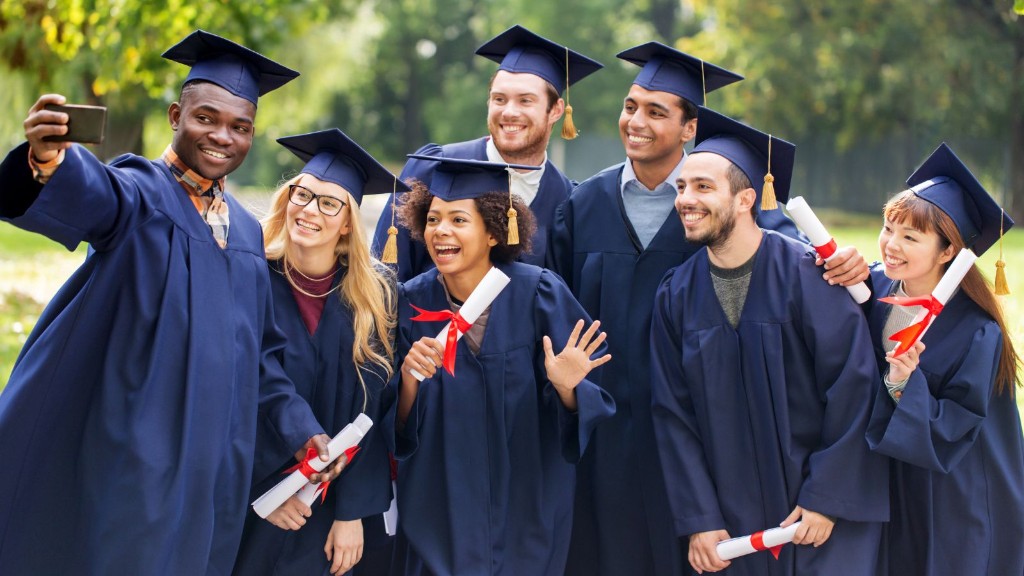 Graduates in academic gowns celebrating outdoors