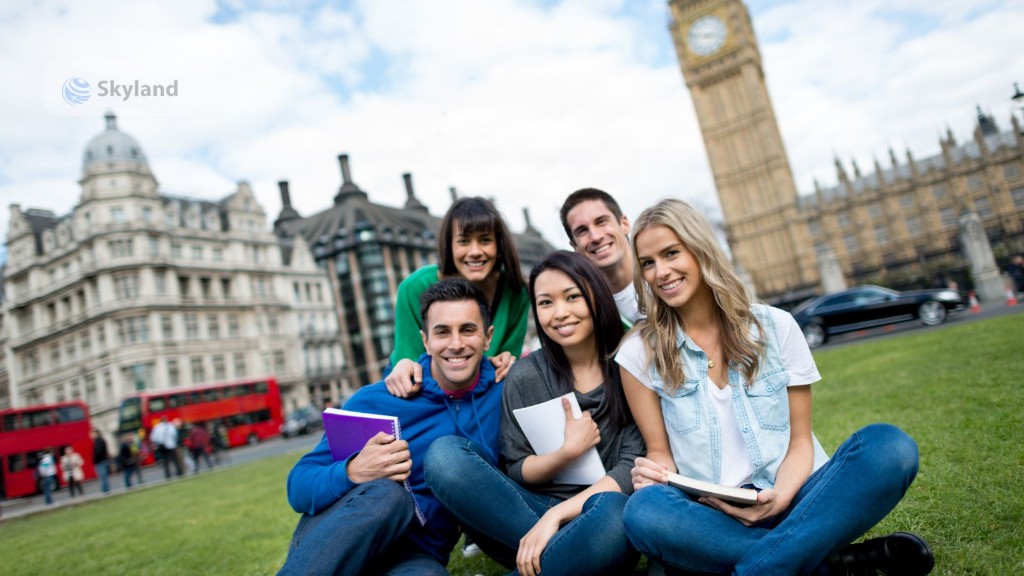 Students in London with Big Ben and red double-decker buses